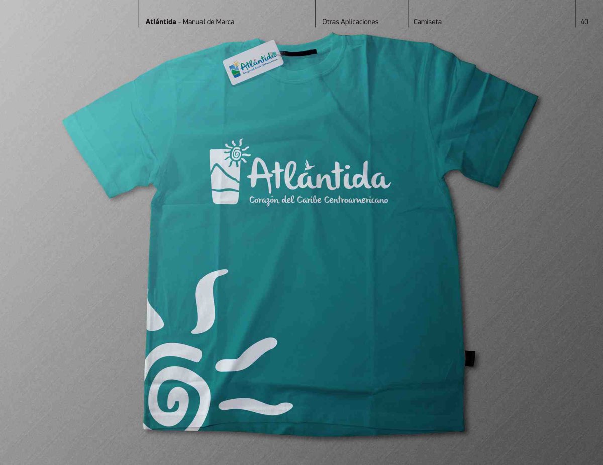 Page 40 of the Atlántida brand manual. In use: a T-shirt carrying the brand's sun.